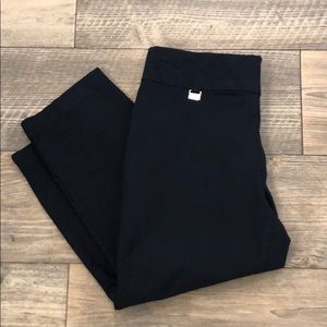 Blue colored tummy-control Capri trouser pants.